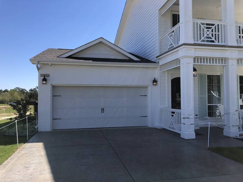 Close view of the white carriage-style garage door on the 2019 St. Jude Dream Home.